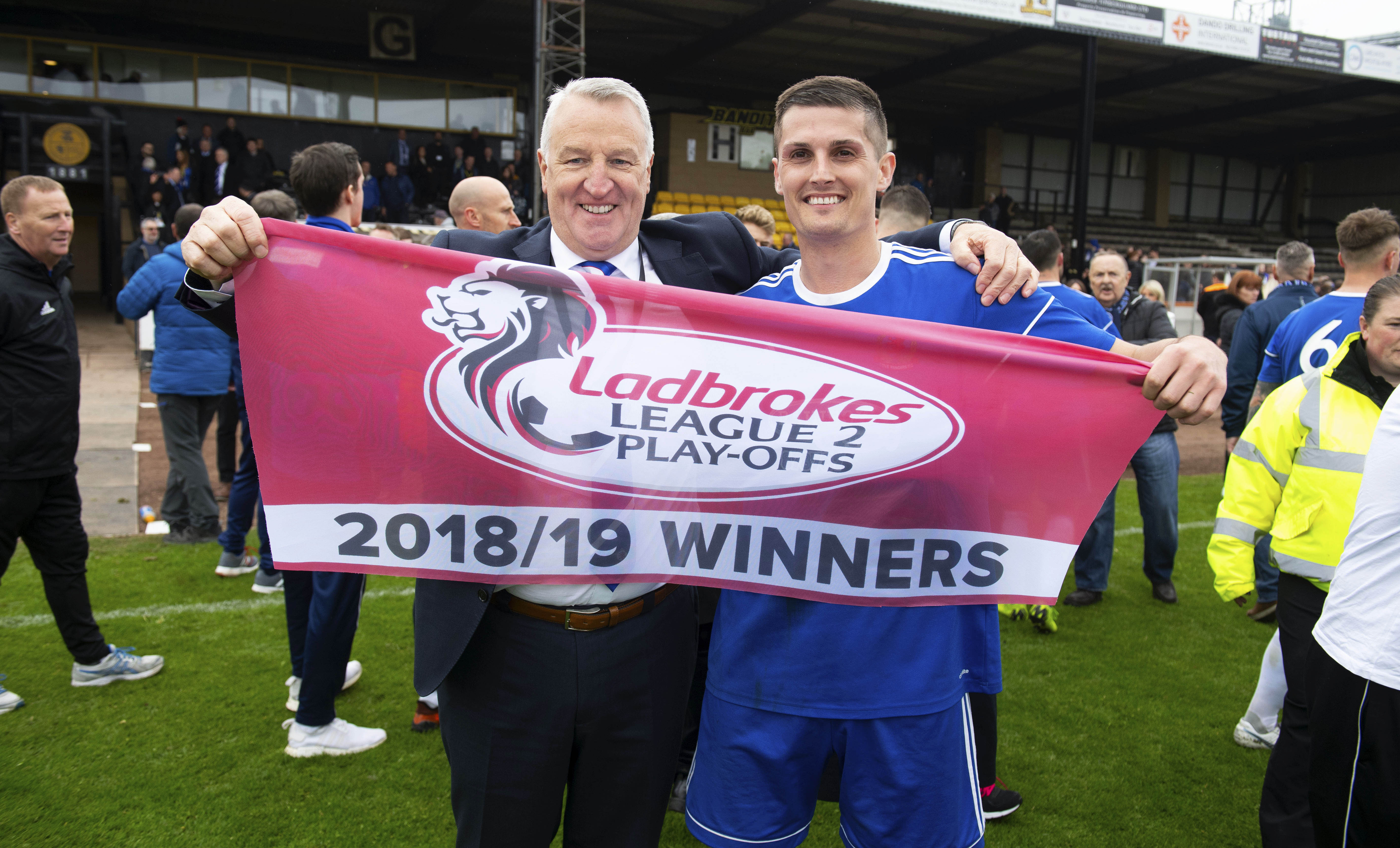 Cove co-manager John Sheran (L) with Daniel Park as they celebrate promotion to Ladbrokes League 2