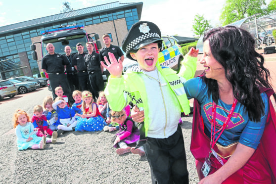 Kerry Glen, manager of the Safe Strong and Free Project, with 5-year-old Callan Mackay from Drakies. Picture by Andrew Smith.