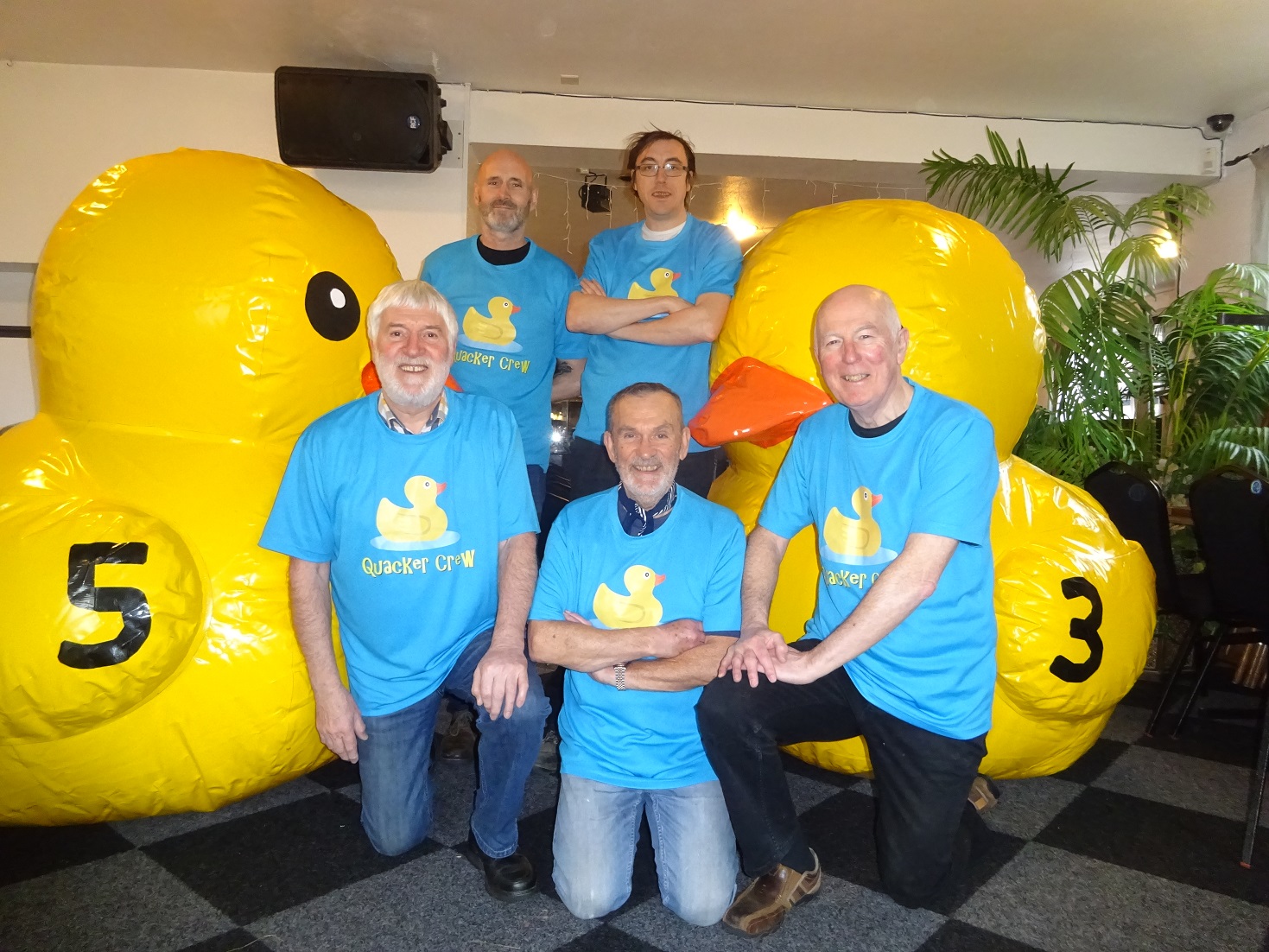 As a dozen giant rubber ducks prepare to race down the River Dee, here