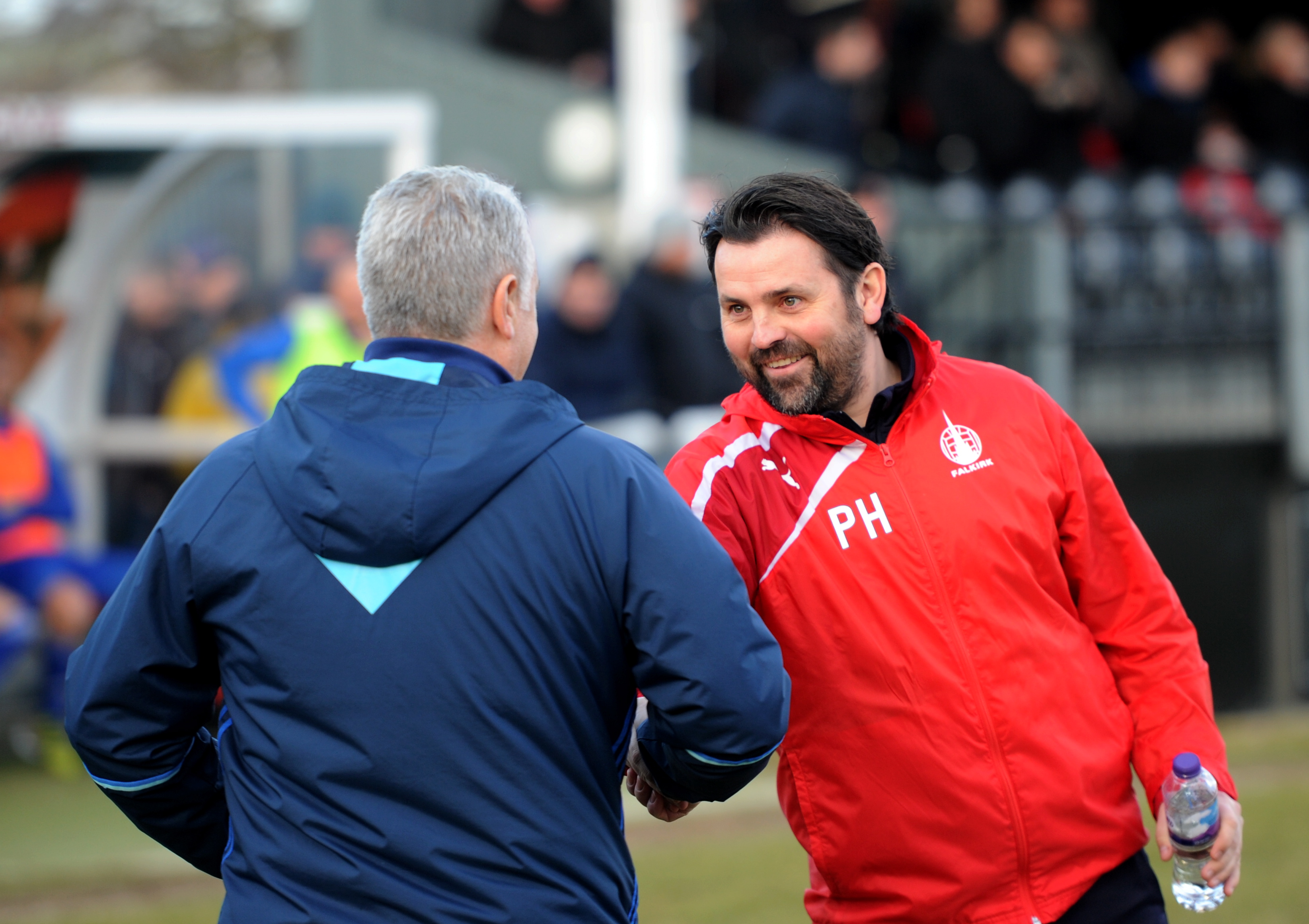 Paul Hartley and John Sheran shake hands ahead of Cove Rangers' Scottish Cup tie with Falkirk in 2018.