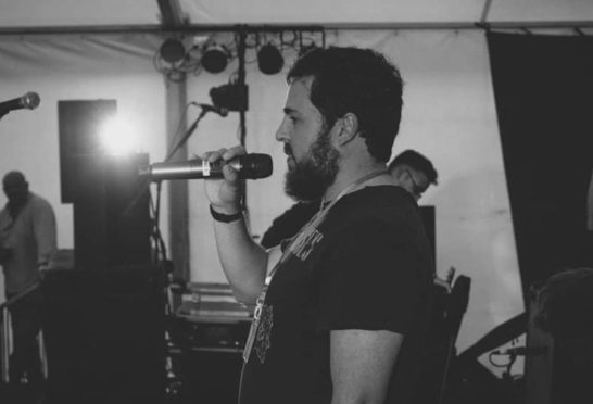 David Stewart pictured on the Lizard Festival stage in 2017 thanking the sponsors for their work