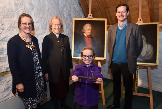 Pictured (from left) are Lucy Hodgson, mum Diana Russell and son Alec Russell. Nine year old Finn Carden from Kininmonth Primary School holds a key the family donated to the museum.