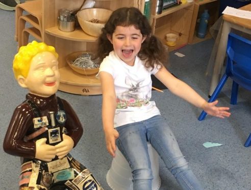 Ava Buchan with Peterhead Central Nursery's decorated Oor Wullie