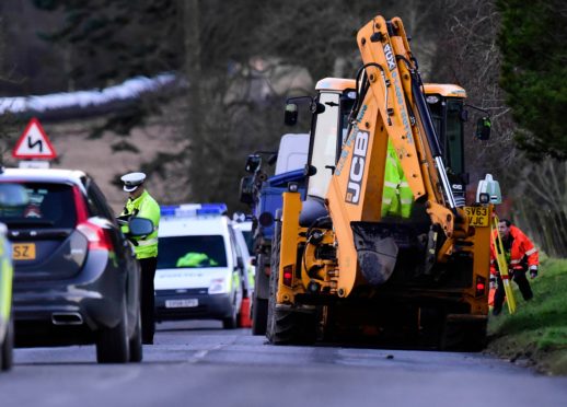 Police at the scene of the incident on the B9005 near Gight.