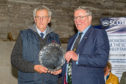 Colin MacGregor, (left), Lochearnhead, is presented with the NSA's Silver Salver by NFU Scotland president Andrew McCornick.