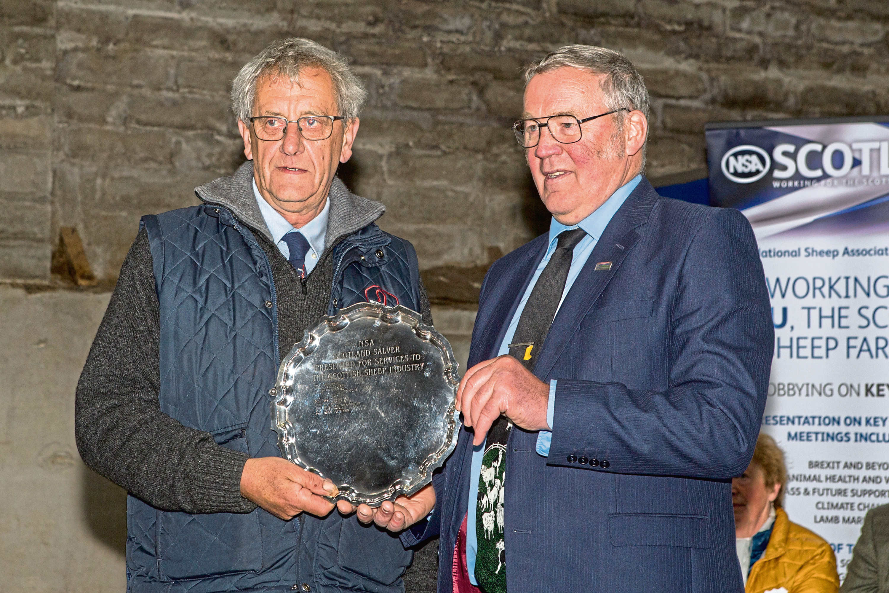 Colin MacGregor, (left), Lochearnhead, is presented with the NSA's Silver Salver by NFU Scotland president Andrew McCornick.