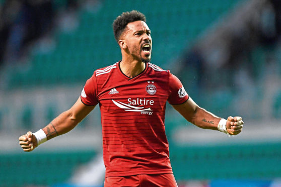 Shay Logan celebrates at full-time against Hibs.