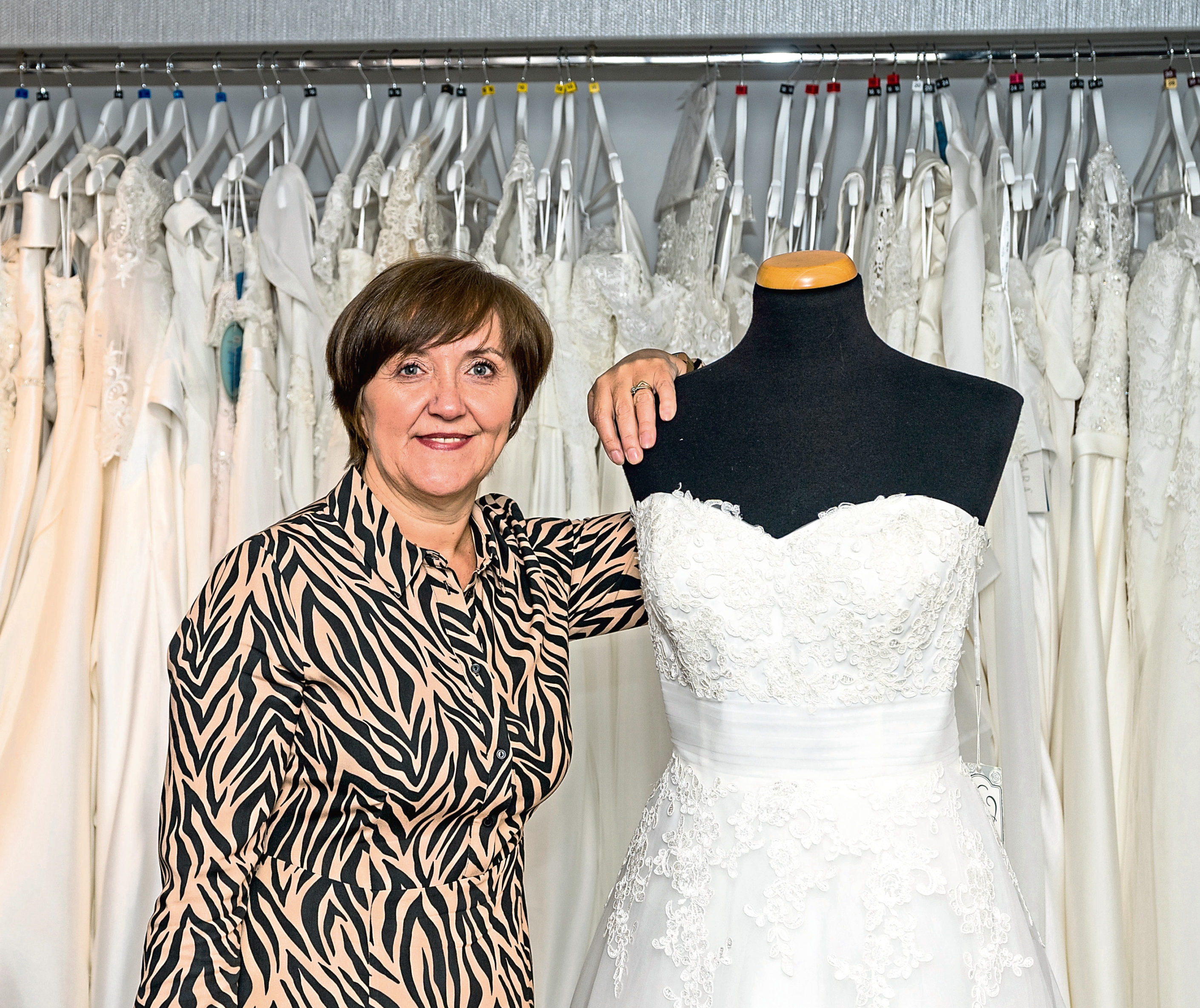 Christine Fraser within her business premises supplying Ladies Fashions and Bridal Boutique.