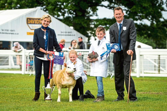 Judges Patsy and Ian Hunter with the young handler winners