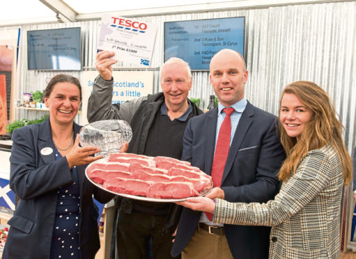 Archie collecting the tropy ,with left, Kate Rowell, chairman of Quality Meat Scotland, and to the right Jonathan Forses, from Kepak Group and Hannah Donegan from Tesco.
