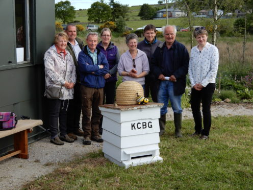 (left to right) 
Kemnay Community Bee Group Committee members:
Lorraine Reid
Andrew Henderson
Ian Murray
Angela Allan (Secretary)
Erica Wilkinson (Treasurer)
David Wilkinson
Alan Simpson (President)
Sonya MacPherson (Chairperson