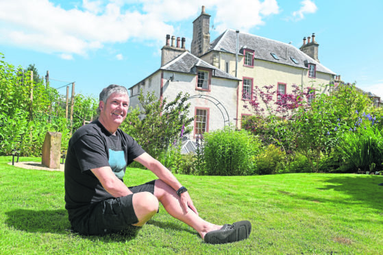 Councillor Craig Fraser in his garden as part of the Cromarty Open Gardens Day. Picture by Sandy McCook