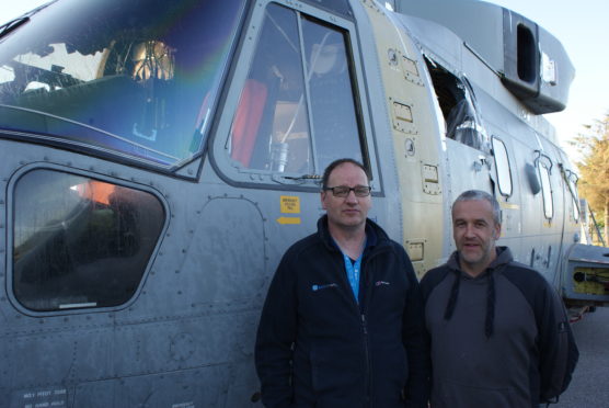 Morayvia Chairman Mark Mair and Director Richard Murray with the Merlin Helicopter