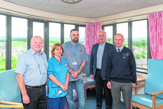 This is the Elgin Rotary Club presenting new funding to The Friends of Dr Grays Hospital with new funding to update the Ward 6 Dayroom. PICTURE CONTENT:- L-R - Ken Brown, Friends of Dr Grays, Carla Gordon, Nurse Ward 6, Tim Wakefield, Chair of Friends Dr Grays, Jim Royan, Elgin Rotary and George Duthie, President of Elgin Rotary