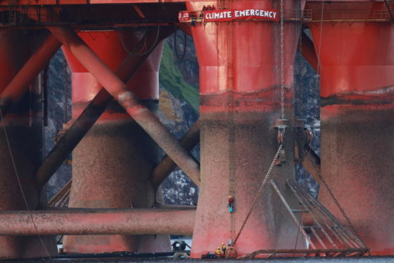 Greenpeace climbers on BP oil rig in Cromarty Firth, Scotland