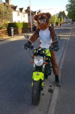 George MacIver, 55, dressed as a bear for a previous charity run.