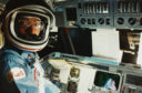 (Original Caption) Earth Orbit - Commander John W. Young of the Space Shuttle mission STS-9 is at the commander's station ready for the re-entry of the Space Shuttle Columbia.
