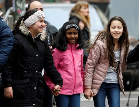 BERLIN, GERMANY - MARCH  21 :  Hundreds of people, mostly children form a human chain at Adalbert Street in Berlin's Kreuzberg as part of the International Day for the Elimination of Racial Discrimination in Germany on March 21, 2019. (Photo by Abdulhamid Hosbas/Anadolu Agency/Getty Images)