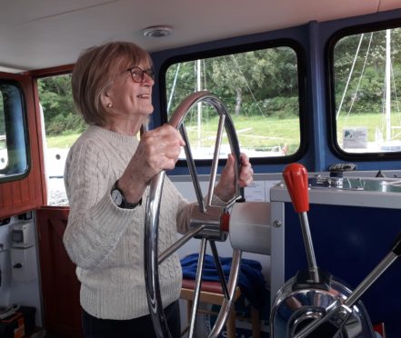 Nairn Contact the Elderly guest Frances takes to the helm on the Caledonian Canal outing