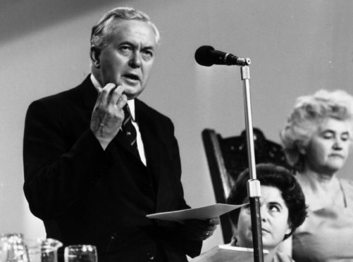 7th October 1968:  Prime Minister, Harold Wilson (1916 - 1995) making a speech In the background is Jenny Lee, widow of Aneurin Bevan who was influential in setting up the Open University.  (Photo by Evening Standard/Getty Images)