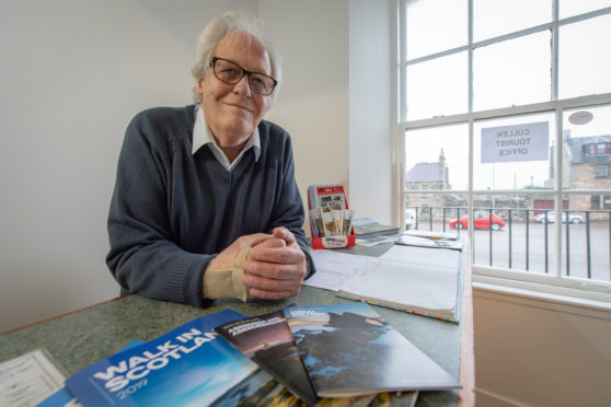 Graham Bell, Secretary of Cullen Voluntary Tourist Initiative, inside the Tourist Information office in Cullen.