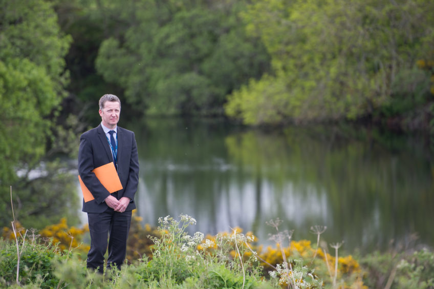 Detective Inspector Brian Geddes is pictured at the loch. Picture by Jason Hedges.