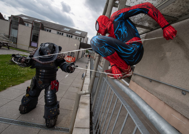 Moray College in Elgin hosts a mini comic con. 
Picture: Rhino (Ronz Meikle) battles with Spiderman (James Murray). 


Pictures by JASON HEDGES