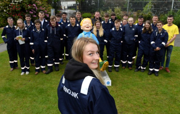 The 24 new Ringlink apprentices at the company sponsored Oor Wullie which is on display at Hazlehead Park, with apprentice Mhari Ross out front.
