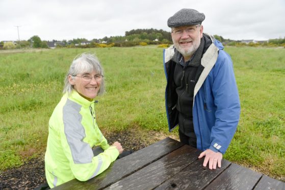Richard Fyfe, Chairman of the Culbokie Community Trust with director Penny Edwards at the Glascairn site in the village.
