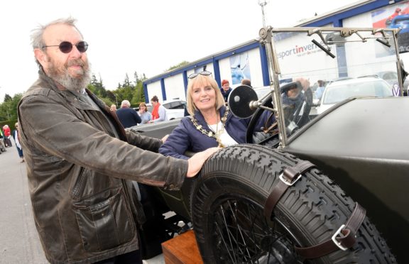 Provost Helen Carmichael who waved the cars off photographed with Mike Holt and his 1922 Vauxhall 23/60.