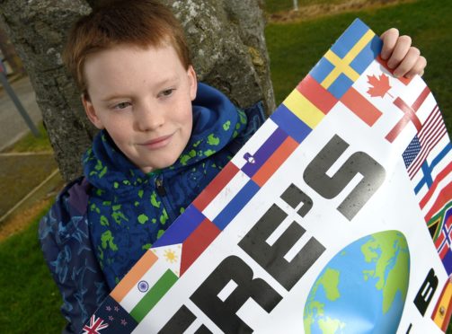 Finlay Pringle (11) photographed outside the school during one of his strikes in aid of climate concerns. Picture by Sandy McCook.