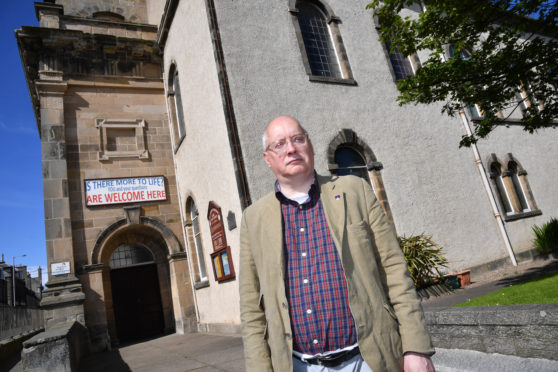 CLLR GLENN REYNOLDS AT BANFF PARISH CHURCH.