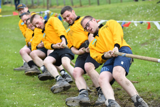 Keith young farmers dig in to victory in the tug-o-war competition.