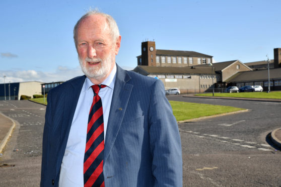 CLLR AND FORMER TEACHER CHARLES BUCHAN WEARING HIS SCHOOL TIE AT FRASERBURGH ACADEMY.