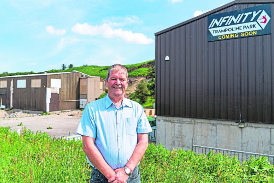 Councillor Gordon Cowie outside the proposed Trampoline Park.