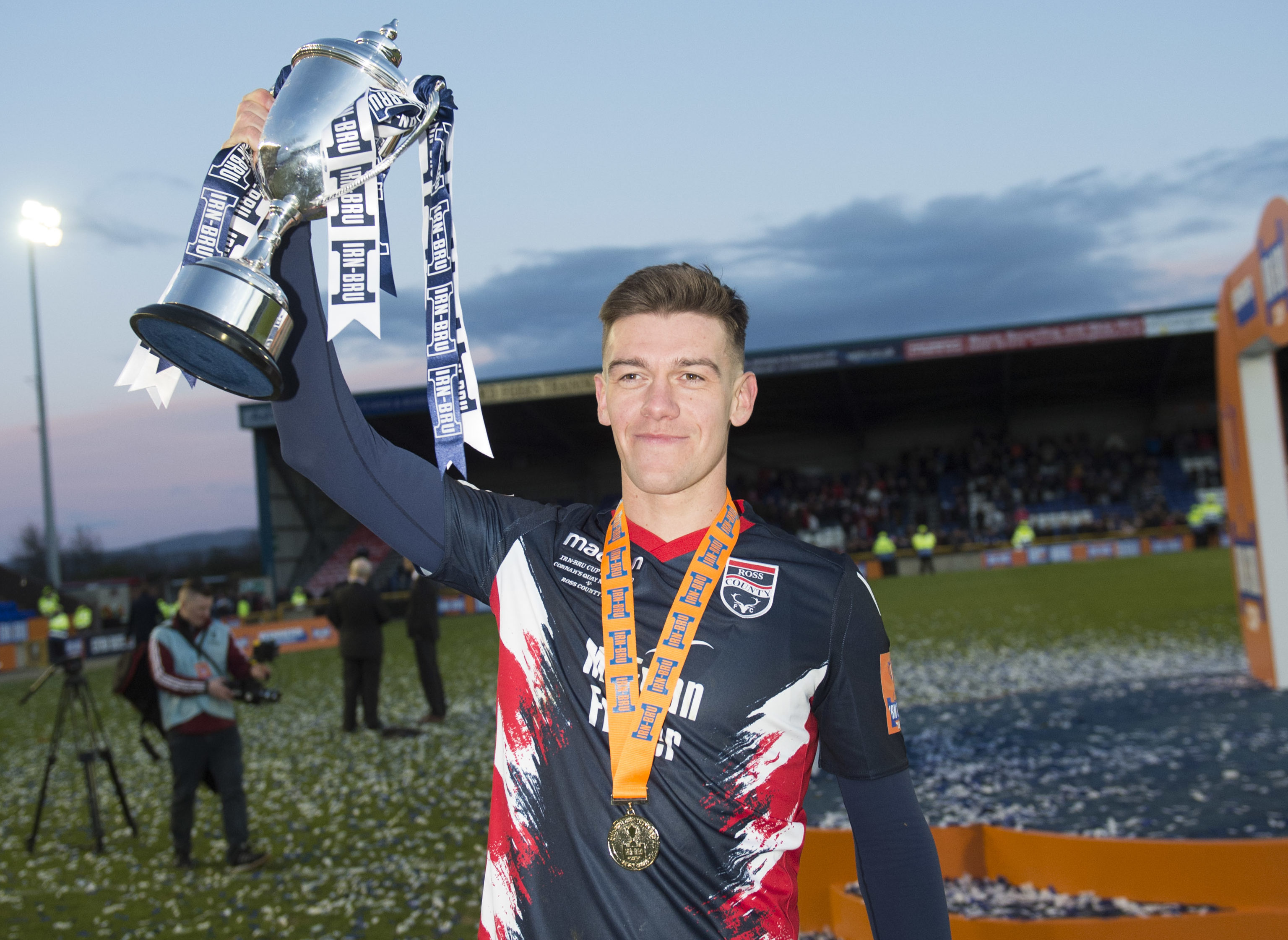 Ross County's Josh Mullin parades the Championship trophy.