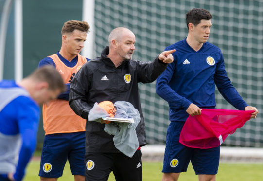 Aberdeen defender Scott McKenna, right, with Scotland manager Steve Clarke.