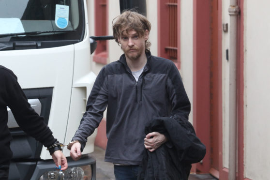 Simon Junor being taken from Inverness Sheriff Court.