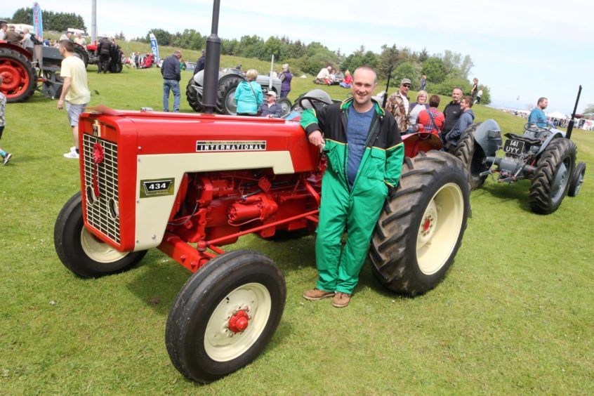 Douglas Johnstone with his International 434 tractor.