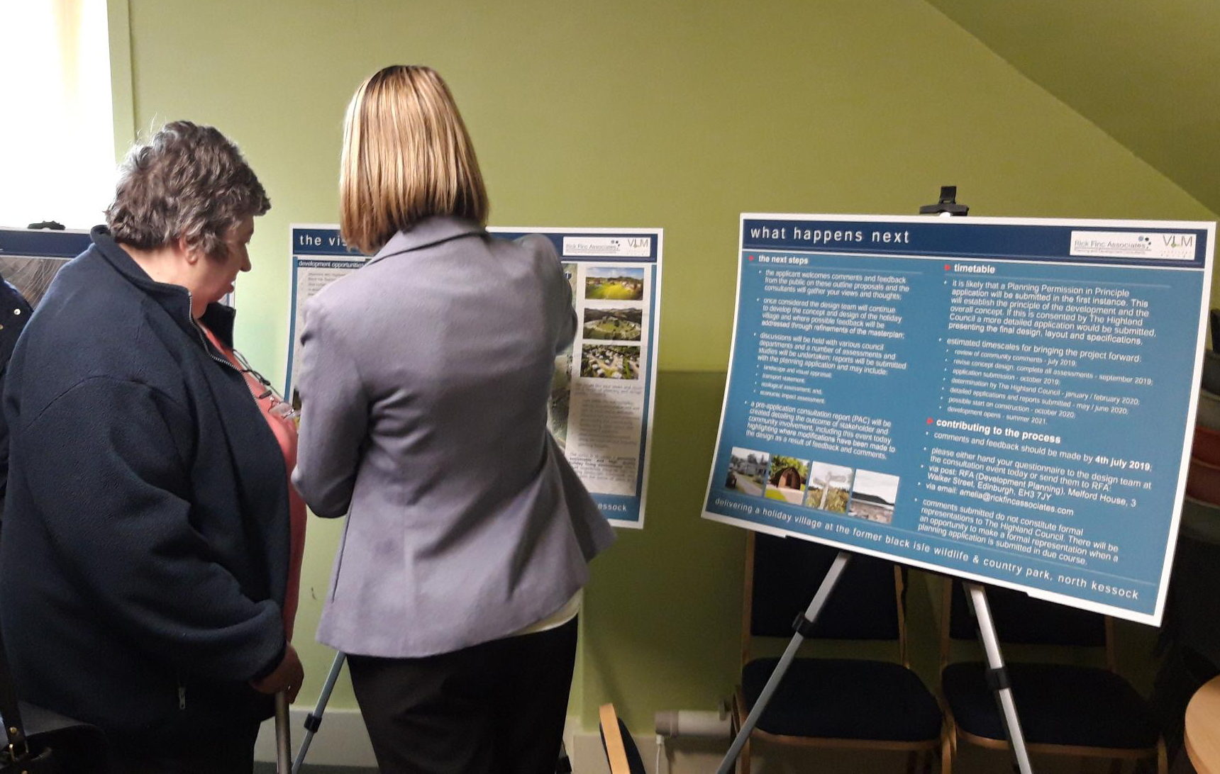 Residents inspect the plans