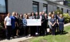 Hospital staff gift a £5,620 cheque.