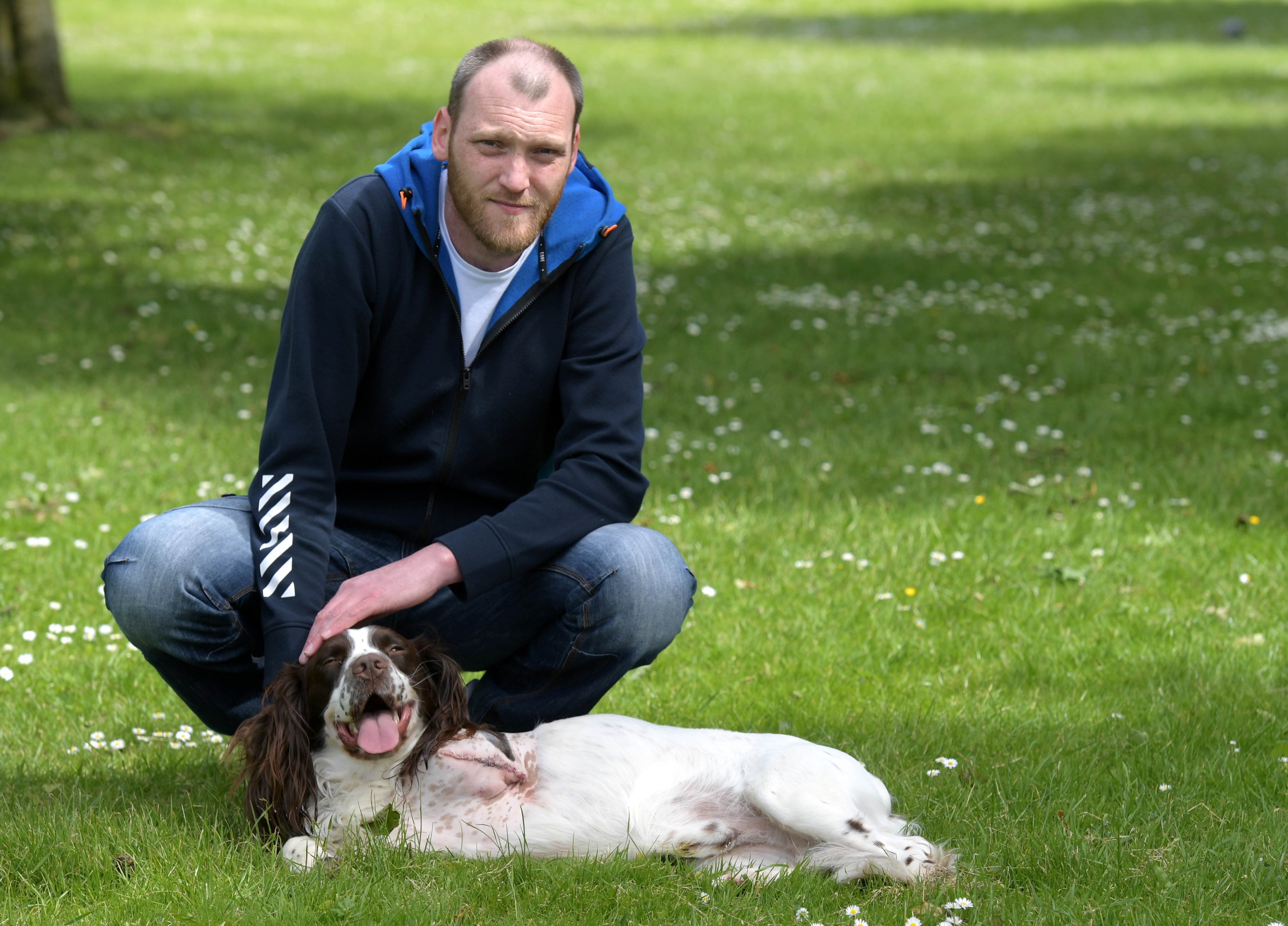 John Holt's dog lost a leg after falling down a hole. He blames the council for not filling it. Pictured is John with his dog Elmo. by Kath Flannerty