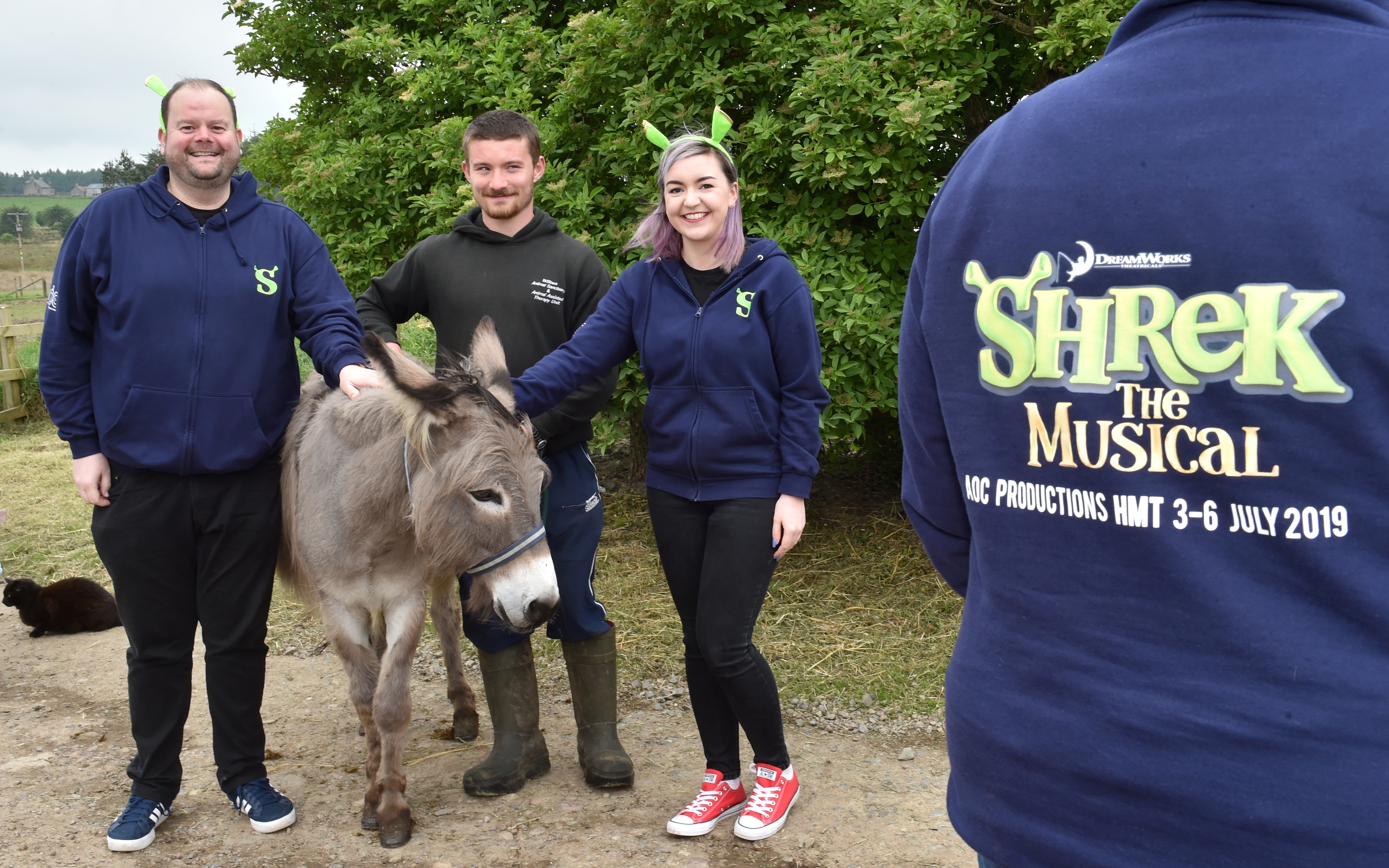 The cast of Shrek visited Willows and met Eeyore the donkey. Pictured (from left) is Scott Jamieson (Shrek), Michael Brown, animal husbandary and Hannah Smith (Sugar Plum Fairy)