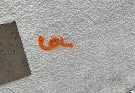 Vandals spray-painted the word LOL on a house in Portsoy