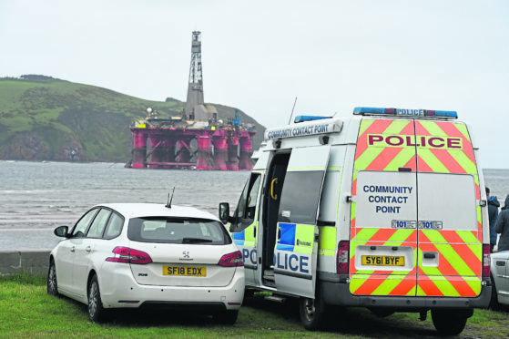 Police at the scene near the Greenpeace-occupied rig, Paul B Lloyd Jr