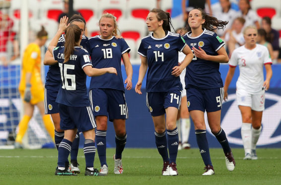 Claire Emslie of Scotland celebrates with teammates.