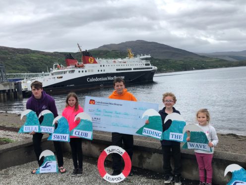 Junior members of the Ullapool Swim Club show off their CalMac Community Fund cheque.