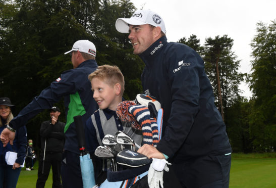 Richie Ramsay poses with local children during a golf clinic at the Aberdeen Standard Investments Scottish Open at The Renaissance Club.