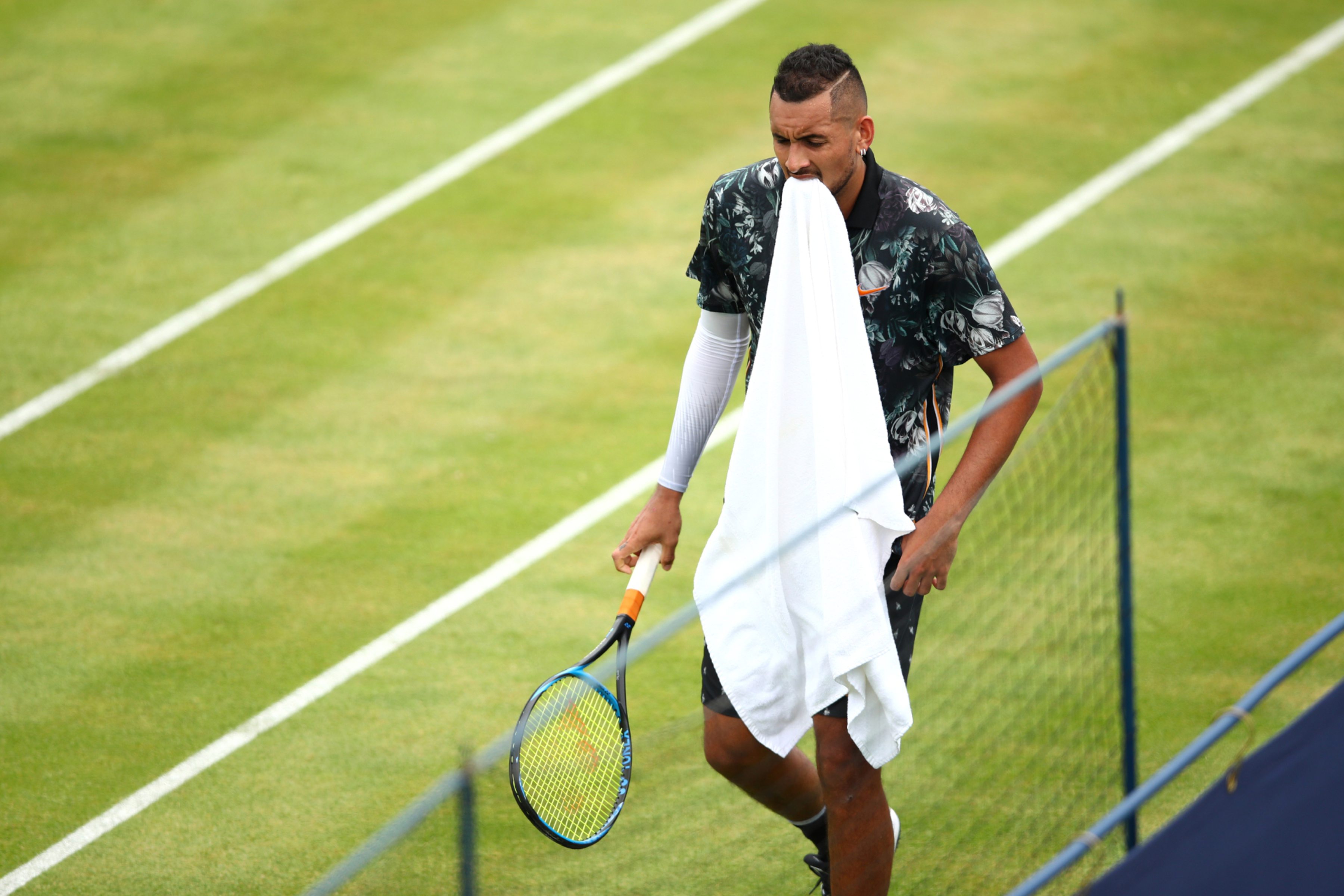 LONDON, ENGLAND - JUNE 20: Nick Kyrgios of Australia reacts during his First Round Singles Match against Roberto Carballes Baena of Spain during day Four of the Fever-Tree Championships at Queens Club on June 20, 2019 in London, United Kingdom. (Photo by Clive Brunskill/Getty Images)