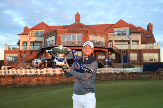 Bernd Wiesberger of Austria celebrates with the trophy following victory in the Aberdeen Standard Investments Scottish Open at The Renaissance Club on July 14, 2019 in North Berwick.